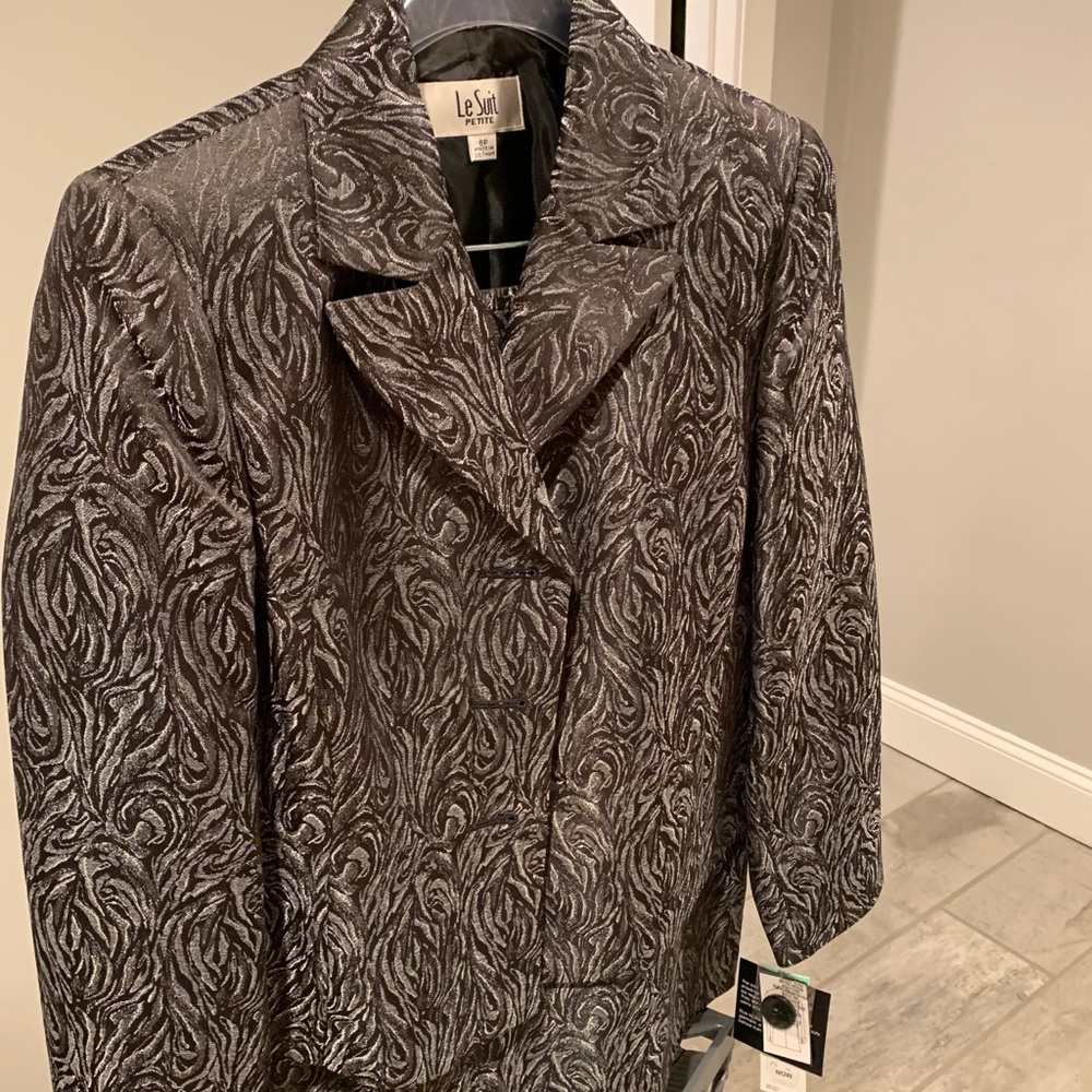 Brand new skirt suit never worn with tags